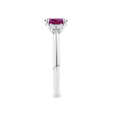 1.15 Carat Burmese Ruby and 0.40ct TW Diamond Ring in 18ct White Gold — This side profile highlights the ring's tapered gallery and the natural oval-cut diamonds along the shoulders. The 18ct white gold band maintains a slim, elegant silhouette from every angle.