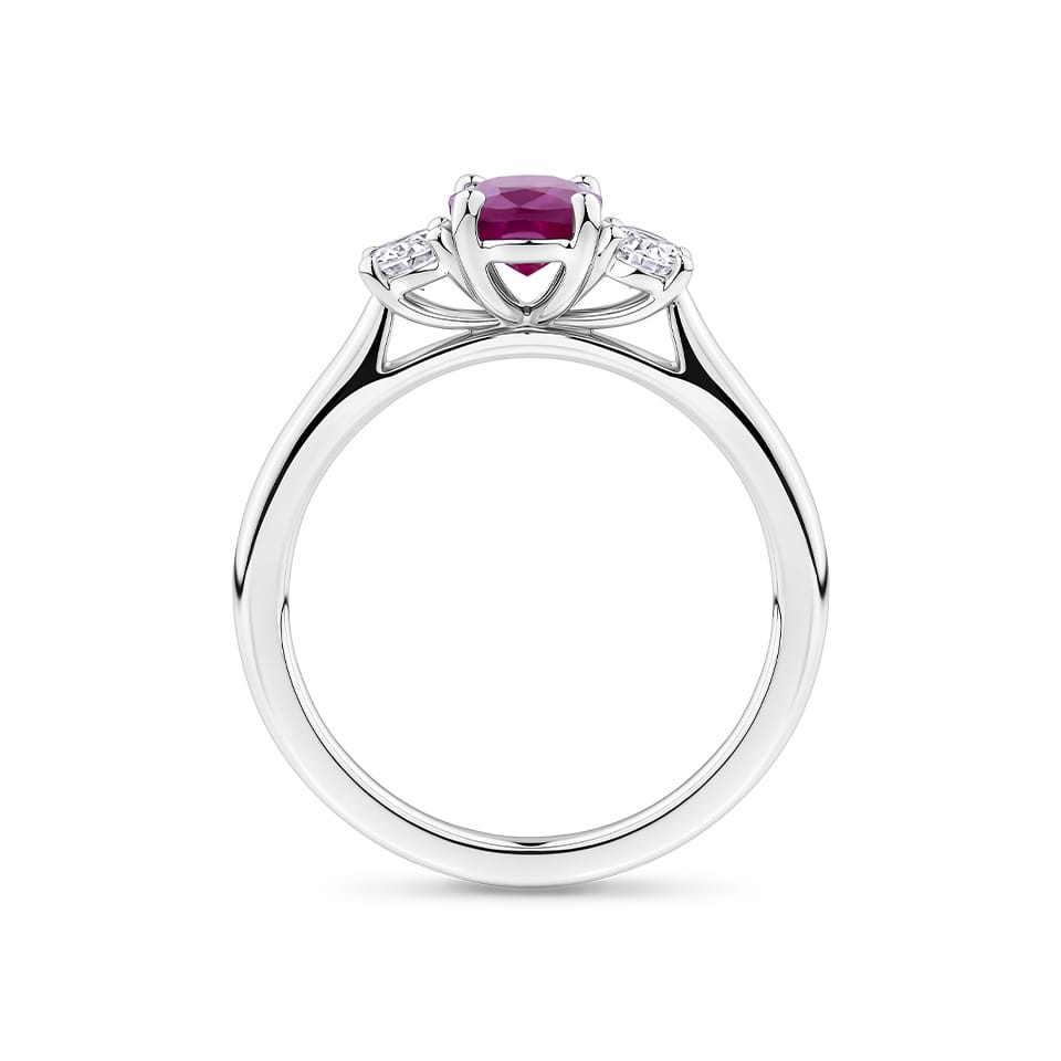 1.15 Carat Burmese Ruby and 0.40ct TW Diamond Ring in 18ct White Gold — Viewed from the front, the ring showcases its balanced three-stone design with the certified Burmese ruby set high above a diamond-lined band. The 18ct white gold setting offers a bright, cool contrast to the ruby's deep tone.