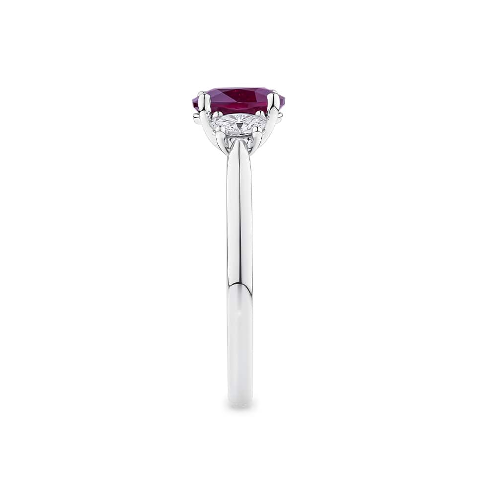 1.33 Carat Ruby and 0.40 Carat TW Diamond Ring in 18ct White Gold — This side profile highlights the ring's tapered gallery and the natural oval-cut diamonds set along the shoulders. The 18ct white gold band maintains a slim, elegant silhouette from every angle.