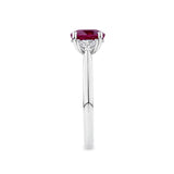 1.39 Carat Burmese Ruby and 0.36 Carat TW Diamond Trilogy Ring in 18ct White Gold — This side profile highlights the ring's tapered gallery and the heart-cut diamonds set with their points facing along the band. The 18ct white gold band maintains a slim, elegant silhouette from every angle.