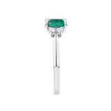 1.81 Carat Emerald and 0.30 Carat TW Diamond Trilogy Ring in 18ct White Gold — This side profile highlights the ring's tapered gallery and the natural emerald-cut diamonds set along each shoulder. The 18ct white gold band maintains a slim, elegant silhouette from every angle.