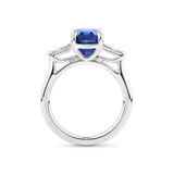 4.05 Carat Sapphire and 0.18 TW Carat Diamond Trilogy Ring in 18ct White Gold — Viewed from the front, the ring showcases its trilogy design with the emerald-cut sapphire set above tapered baguette diamonds on either side. The 18ct white gold setting frames the stones in a bright, cool tone.