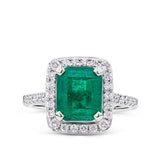 2.59 Carat Emerald and 0.50 Carat TW Diamond Halo Ring in 18ct White Gold
