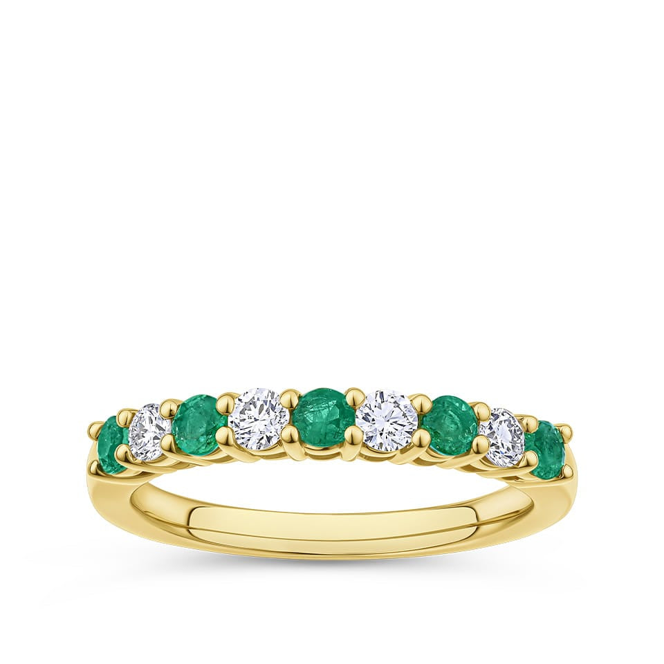 Emerald and Diamond Alternating Ring in 18ct yellow gold from Hardy Brothers Jewellers, shown front-on with its alternating emerald and diamond row.