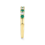 Side view of the Emerald and Diamond Alternating Ring in 18ct yellow gold by Hardy Brothers, highlighting the claw-set stones and polished band.