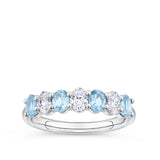 Aquamarine and Diamond Half Eternity Ring in 18ct white gold from Hardy Brothers Jewellers, shown front-on with its alternating oval cut aquamarines and natural diamonds.