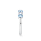 Top-down view of the Aquamarine and Diamond Half Eternity Ring in 18ct white gold by Hardy Brothers, showing the alternating row of oval cut aquamarines and diamonds across the top of the band.