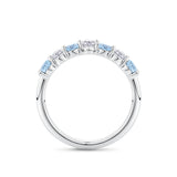 Side-on view of the Aquamarine and Diamond Half Eternity Ring in 18ct white gold by Hardy Brothers, highlighting the claw-set stones and polished gold underside.