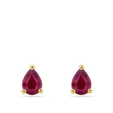 A pair of Pear Cut Ruby Stud Earrings in 18ct Yellow Gold featuring faceted teardrop-shaped ruby in a three-prong setting