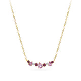 Close-up detail of the Elysian Diamond, Ruby and Tourmaline Cluster Necklace in 18ct yellow gold by Hardy Brothers, highlighting the pink tourmaline, ruby and diamond cluster.