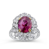 VAULT® 6.09 Carat TW Oval Cut Ruby and 2.44 Carat TW Diamond Halo Ring in 18ct Yellow and White Gold
