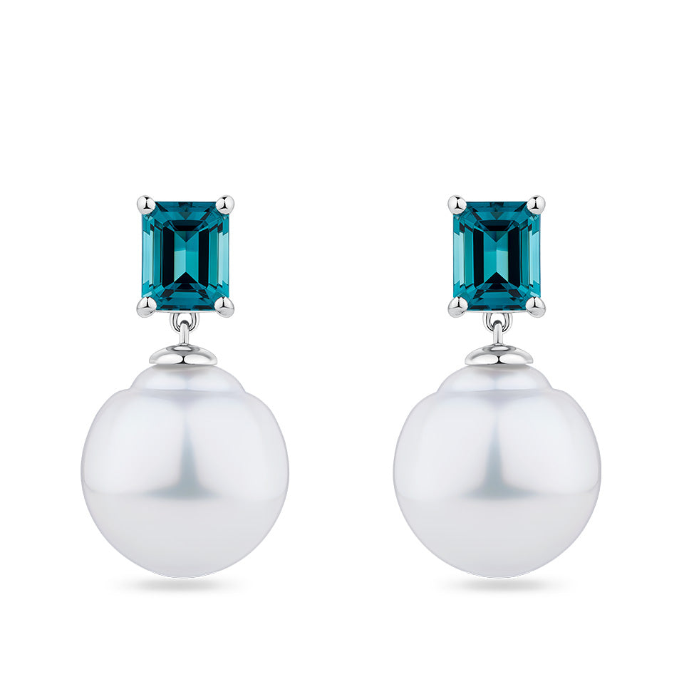 South Sea Pearl and Tourmaline Stud Earrings in 18ct white gold from Hardy Brothers Jewellers, shown front-on as a pair with a lagoon blue tourmaline stud and South Sea pearl drop on each earring.