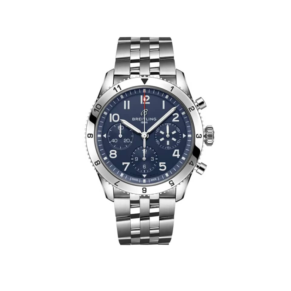 Breitling Classic AVI Automatic Chronograph 42mm Watch A233801A1C1A1 displays its blue dial with large, legible Arabic numerals and a matching knurled bezel. The stainless steel case pays tribute to the Vought F4U Corsair's signature blue livery.