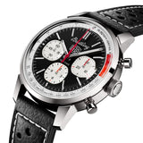 Breitling Top Time Deus B01 Chronograph 41mm Watch AB01765A1B1X1 shows the fixed bezel and cambered sapphire crystal from an angled perspective. The perforated black calfskin racing strap curves into the 41mm stainless steel case.