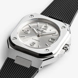 Bell & Ross BR-05 Automatic 40mm Men's Watch, reference BR05A-GR-ST/SRB, captured in side profile to highlight the alternating satin-finished and polished bevels of the steel case. The black rubber strap tapers cleanly from the integrated case design.