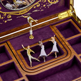 Close-up detail of the Wolf Cinderella Ballet Musical Jewellery Box 190017, focusing on the hand-painted ballerina and marquetry inlay detailing. Two interchangeable ballerinas in different skin tones are included with the piece.