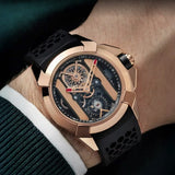 On wrist view of the Jacob & Co. Epic X Bridges 18K Rose Gold Black Manual Wind 44mm Watch, reference EX120.43.AB.AB.A, demonstrating the proportions of the 44mm case against the wrist. The Black Honeycomb Rubber strap contrasts against the 18K Rose Gold case and buckle.