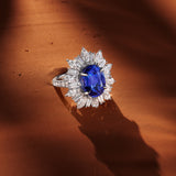 VAULT® 7.80 Carat Oval Cut Tanzanite and 4.91 Carat Diamond Halo Ring in 18ct White Gold