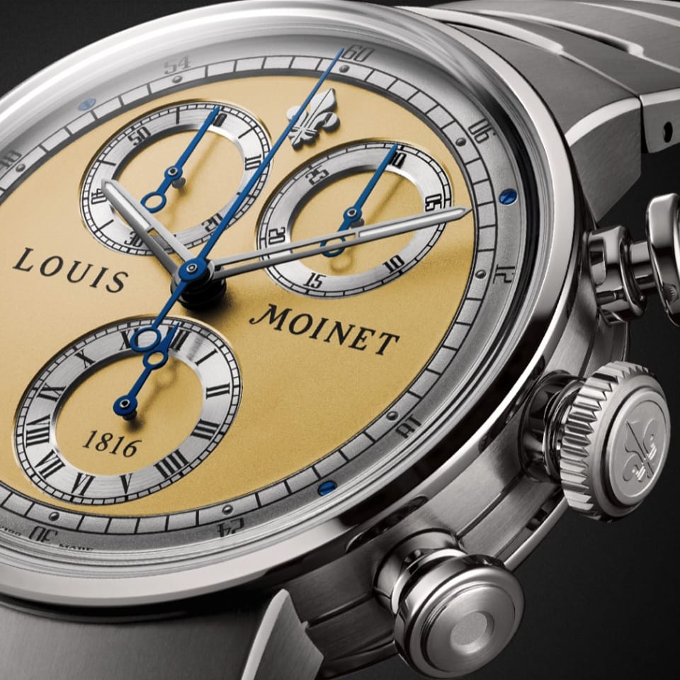 Louis Moinet 1816 Chronograph LM-151.20.30 Men's Titanium Watch — Viewed from a three-quarter angle, the double-gadroon case profile and champagne-coloured DLC-coated bracelet links catch the light. The polished and satin-finished Grade 5 Titanium case is clearly visible.