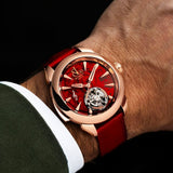 On wrist view of the Jacob & Co. Palatial Flying Tourbillon Minute Repeater 18K Rose Gold Manual 43mm Watch, reference PT500.40.NS.AC.A, demonstrating the proportions of the 43mm case against the wrist. The red alligator strap and 18K Rose Gold case sit together in a warm, tonal palette.