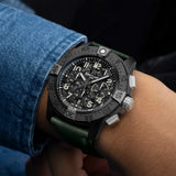 Breitling Super Avenger B01 Chronograph 46mm Watch SB0148101B1X1 is shown worn on the wrist, highlighting the proportions of its 46mm case and khaki green strap. This chronograph delivers 300m water resistance and is powered by the Breitling Manufacture Caliber 01 with an approximate 70-hour power reserve.