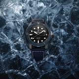 Bremont Supermarine Full Ceramic Deep Blue Automatic Men’s 43mm Watch SM43-DT-BLCER-BK-L-S in a close-up of the dial. The black 3D wave pattern, applied indexes and polished black gold hands sit beneath the domed sapphire crystal.