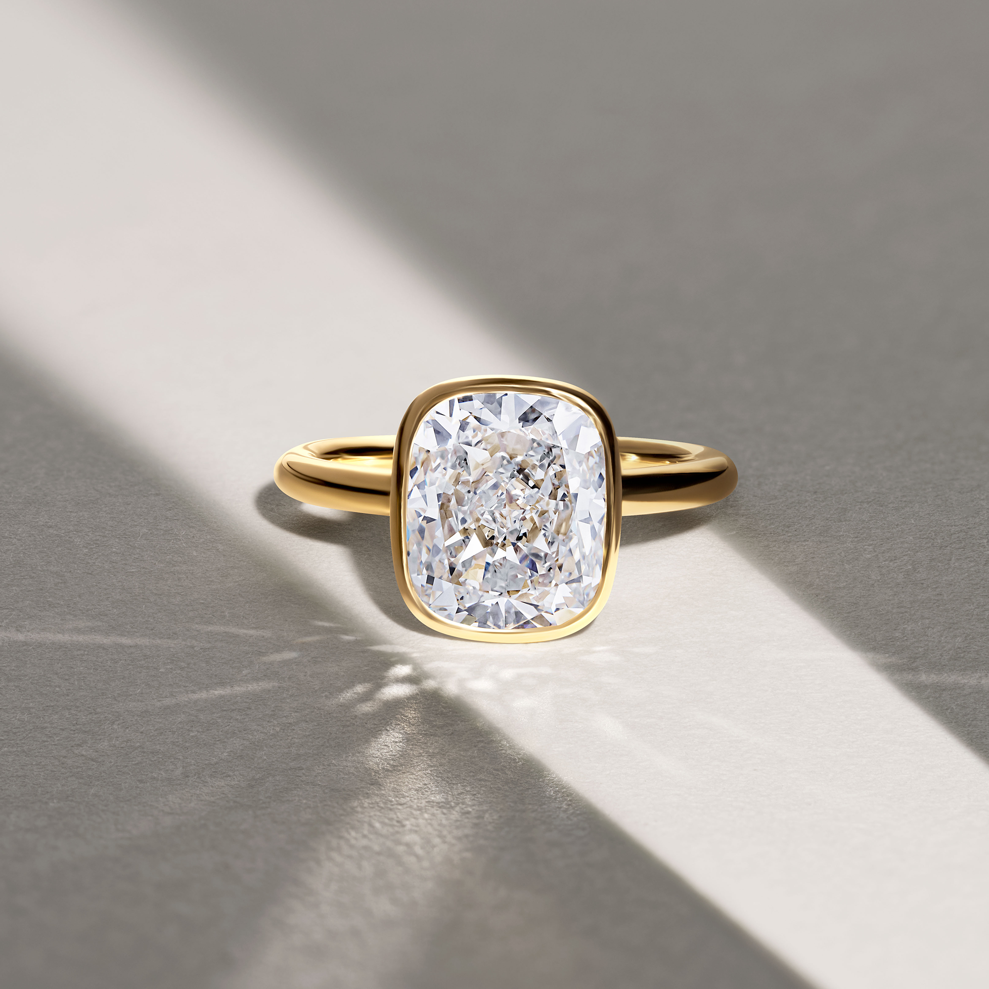 5.19 Carat Cushion Cut Bezel Set Engagement Ring in 18ct Yellow Gold