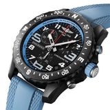 Breitling Endurance Pro Quartz Chronograph 44mm Watch X82310281B1S2 shows the sapphire crystal and textured Breitlight® finish from an angled perspective. The blue rubber strap curves into the 44mm case for an athletic, everyday-wear profile.
