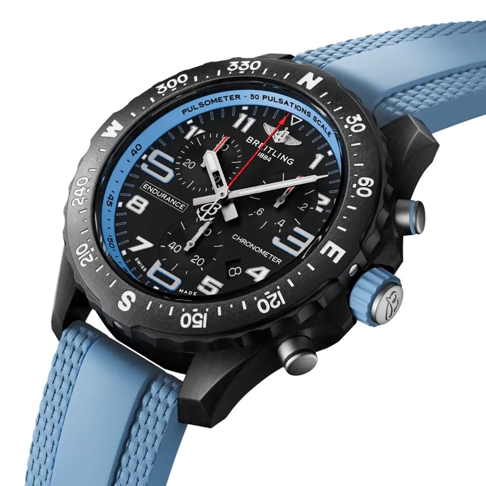 Breitling Endurance Pro Quartz Chronograph 38mm Watch X83310281B1S1 shows the sapphire crystal and textured Breitlight® finish from an angled perspective. The blue rubber strap curves into the 38mm case for an athletic, everyday-wear profile.