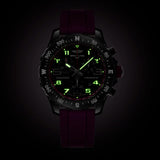 Breitling Endurance Pro Quartz Chronograph 38mm Watch X83310F61B1S1 shows the luminous properties of its dial markers and hands in low light. The black dial and purple accents remain legible against the illuminated Breitlight® case in dark conditions.