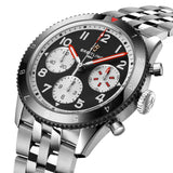 Breitling Classic AVI Automatic Chronograph 42mm Watch Y233801A1B1A1 shows the bidirectional ratcheted bezel and cambered sapphire crystal from an angled perspective. The stainless steel bracelet connects seamlessly to the 42mm case.